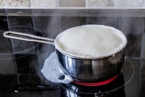 boiling over of milk, ceramic hob, hotplate, pot, milk, foaming milk, branded milk, annoying, to forget, dementia, forgetfulness, reflection, odor, milk splash, steam, boiling milk, hot, milk, milk, milk, milk, milk, boiling milk, boiling milk, boiling milk